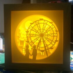 Couple with ferris light box