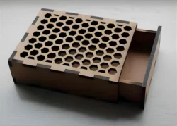 Sliding box with honeycomb cutout pattern