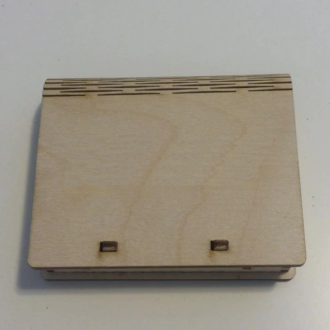 Box with living hinge and spring catch